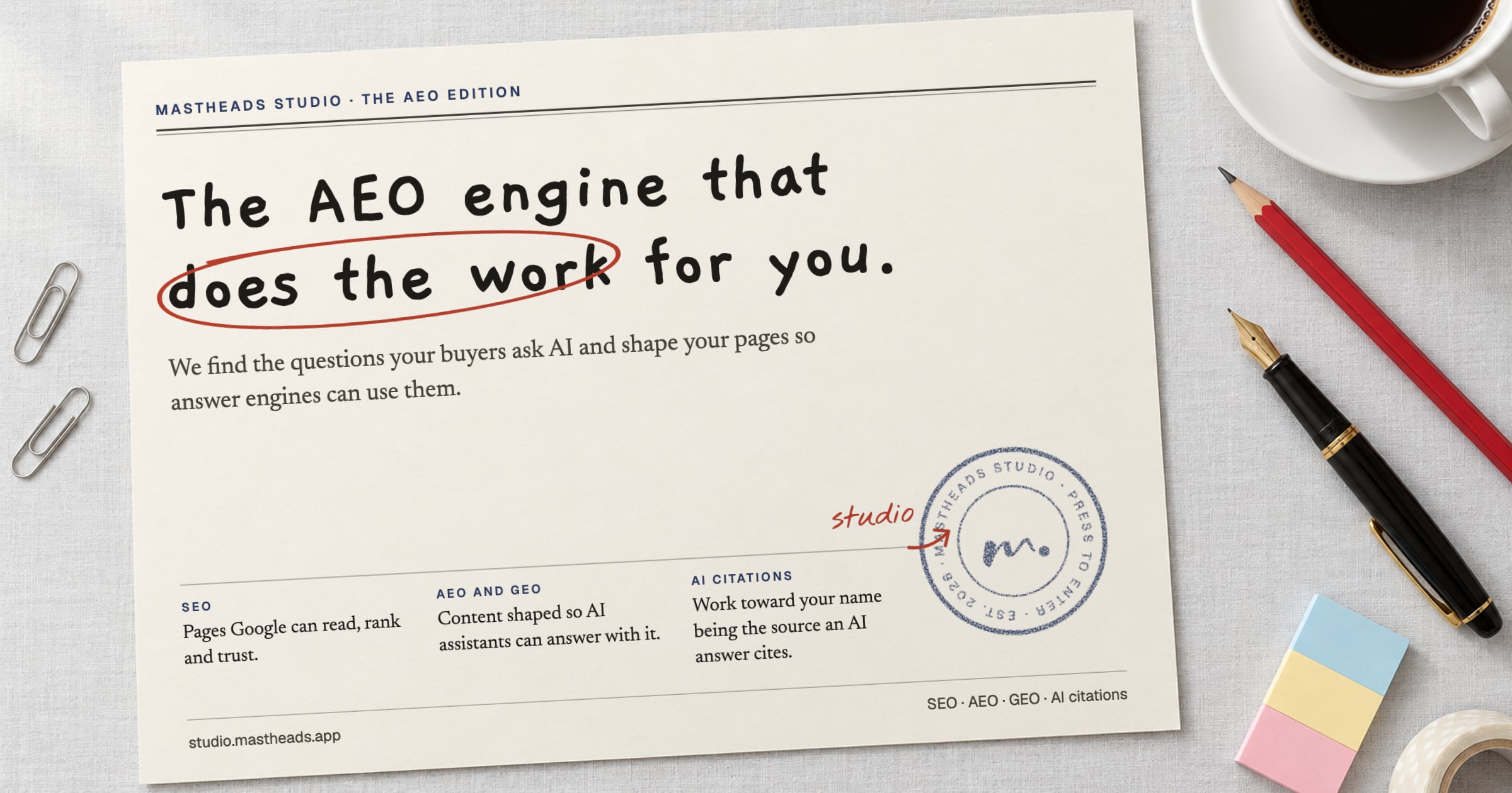 A sheet on the Mastheads Studio desk, handwritten: The AEO engine that does the work for you. Under it: SEO, AEO and GEO, and AI citations, and the Studio seal.
